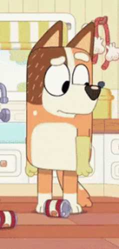 A Cartoon Dog Is Standing In A Kitchen Next To A Can Of Soda . GIF