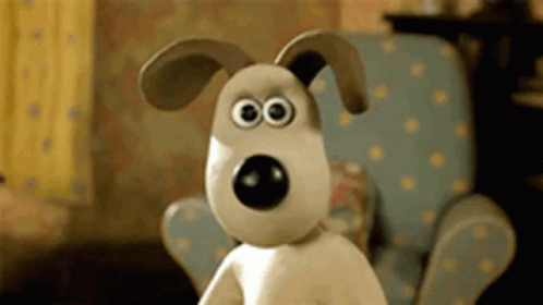 A Cartoon Dog With Big Eyes Is Sitting In A Chair GIF