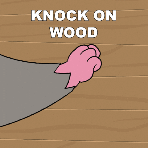 A Cartoon Drawing Of A Cat 'S Paw With The Words Knock On Wood Below It GIF