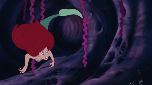 A Cartoon Drawing Of A Mermaid With Red Hair GIF