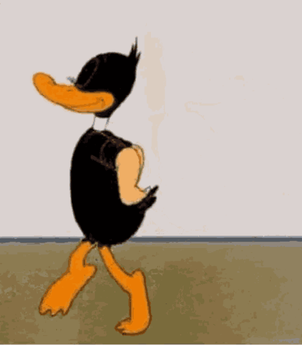 a cartoon duck is standing in front of a white board