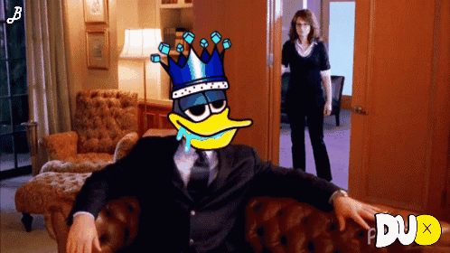 Crowned Cartoon Duck Sitting On Couch GIF