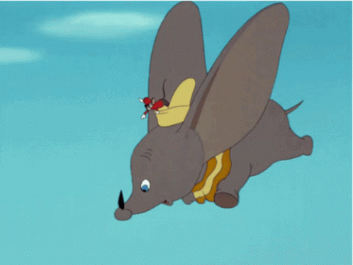 A Cartoon Elephant Is Flying Through The Air With Mickey Mouse Riding On Its Back GIF