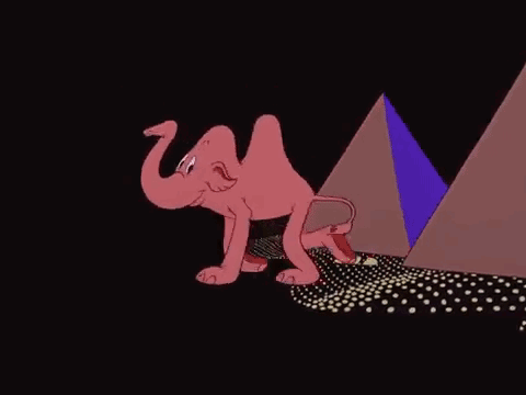 A Cartoon Elephant Is Walking In Front Of A Pyramid In The Dark . GIF