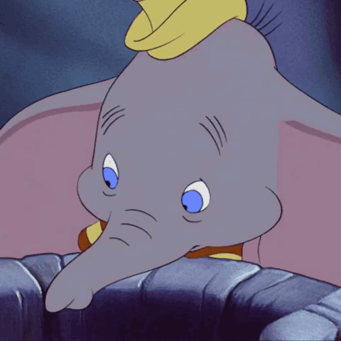 A Cartoon Elephant With Blue Eyes And A Red And Yellow Striped Shirt GIF