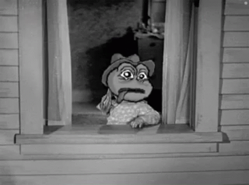 A Cartoon Frog Is Sticking Its Tongue Out Of A Window . GIF