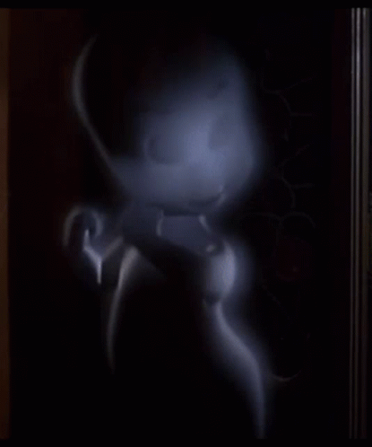 A Cartoon Ghost Is Standing In A Dark Room And Looking At The Camera GIF