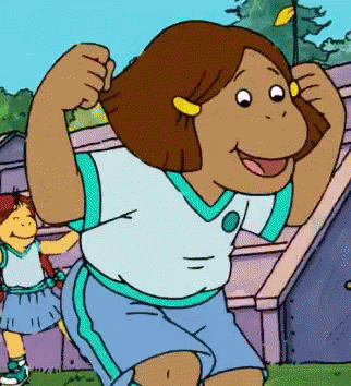 A Cartoon Girl Is Flexing Her Muscles In Front Of A Purple Building GIF