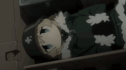 A Cartoon Girl Is Laying On The Floor In A Dark Room . She Is Wearing A Black Hat With A Cross On It . GIF