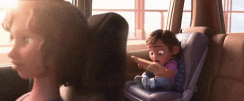 A Cartoon Girl Is Sitting In A Car Seat Looking At A Cell Phone . GIF