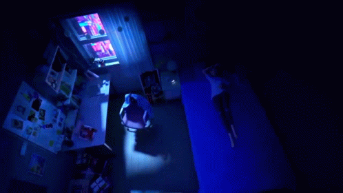 A Cartoon Girl With A Heart On Her Chest Is Laying In Bed GIF