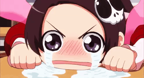 A Cartoon Girl With A Skull On Her Head Is Crying And Making A Funny Face . GIF