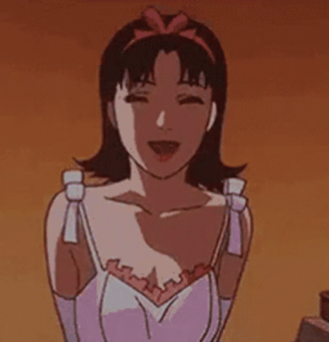 A Cartoon Girl With A Surprised Look On Her Face Is Standing Next To A Bed And Looking At The Camera . GIF