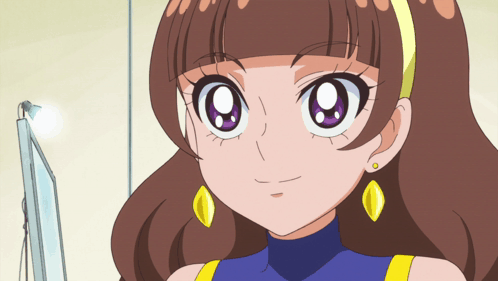 A Cartoon Girl With Brown Hair And Yellow Earrings Is Smiling GIF
