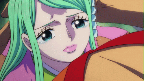 A Cartoon Girl With Green Hair And Blue Eyes GIF