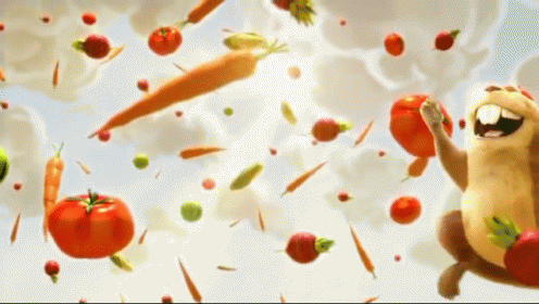 A Cartoon Hamster Is Surrounded By Vegetables Including Carrots Tomatoes And Peppers GIF