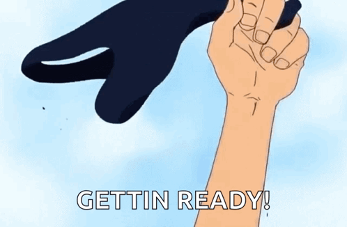 A Cartoon Hand Is Holding A Black Object With The Words Gettin Ready Written On It . GIF