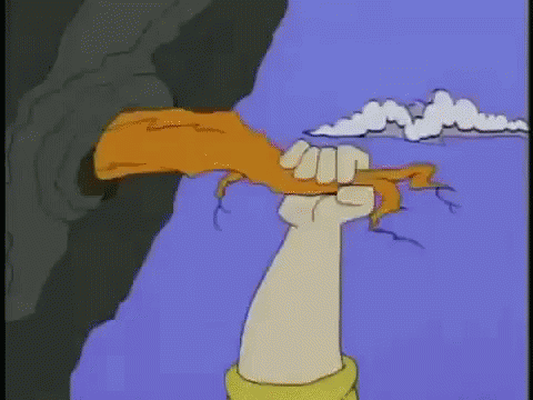 A Cartoon Hand Is Holding A Piece Of Bread In A Fist GIF