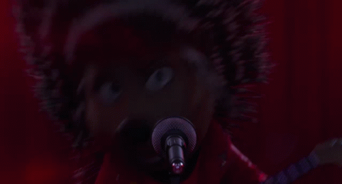 A Cartoon Hedgehog Is Singing Into A Microphone And Playing A Guitar GIF