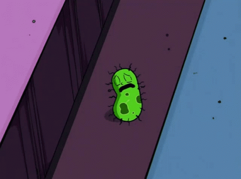 A Cartoon Illustration Of A Green Bacteria With A Sad Face GIF