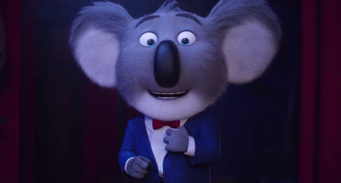 A Cartoon Koala Wearing A Blue Suit And A Bow Tie GIF