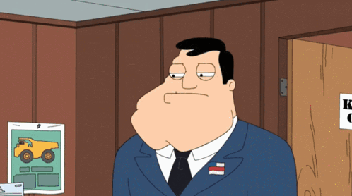 Cartoon Man In Suit And Tie Standing In Front Of Door GIF