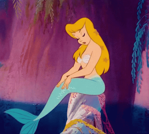 A Cartoon Mermaid Is Sitting On A Rock In The Water GIF