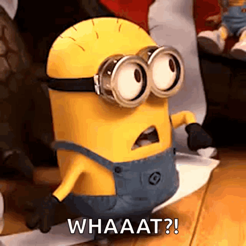 Goggles Minion On Wooden Floor Says Whaat GIF