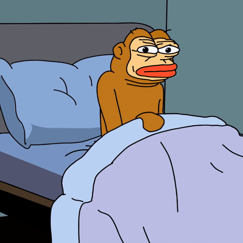 A Cartoon Monkey Is Sitting On A Bed With A Blue Blanket GIF