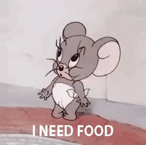 A Cartoon Mouse In A Diaper Is Yawning While Holding A Microphone And Says `` I Need Food '' . GIF