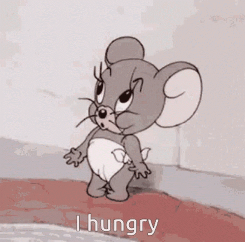 A Cartoon Mouse In A Diaper Is Yawning While Holding A Spoon . GIF