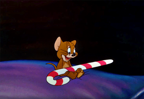 A Cartoon Mouse Is Holding A Candy Cane In His Paws GIF