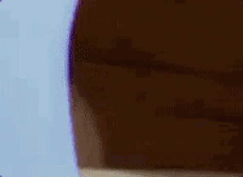 A Cartoon Mouse Is Peeking Out From Behind A Wall And Covering His Face . GIF