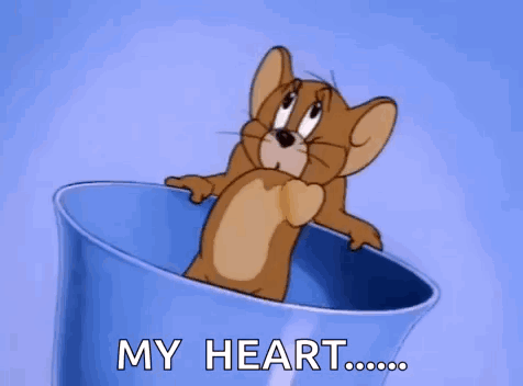 A Cartoon Mouse Is Sitting In A Blue Cup With The Words `` My Heart '' Written On It . GIF