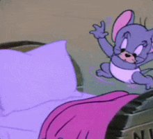 A Cartoon Mouse Is Sitting On A Bed With Purple Sheets GIF