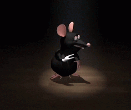 A Cartoon Mouse Is Standing In The Dark And Pointing GIF