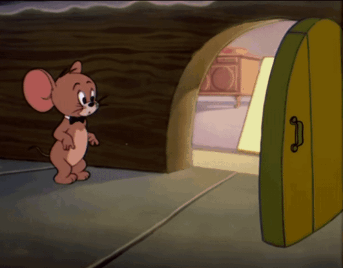 A Cartoon Mouse Named Jerry Is Standing In Front Of An Open Door GIF