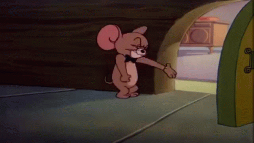 A Cartoon Mouse Wearing A Bow Tie Is Standing In Front Of A Door . GIF