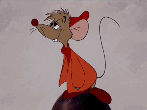 A Cartoon Mouse Wearing A Red Coat And Red Hat GIF