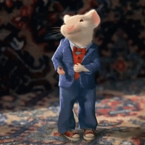 A Cartoon Mouse Wearing A Suit And Tie GIF