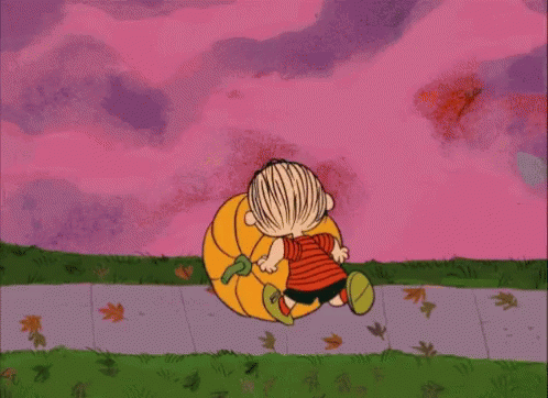 a cartoon of a boy carrying a pumpkin on a sidewalk