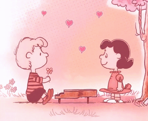 A Cartoon Of A Boy Giving A Flower To A Girl Who Is Sitting At A Piano GIF