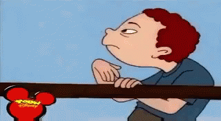 A Cartoon Of A Boy Pointing At A Disney Mouse Head GIF