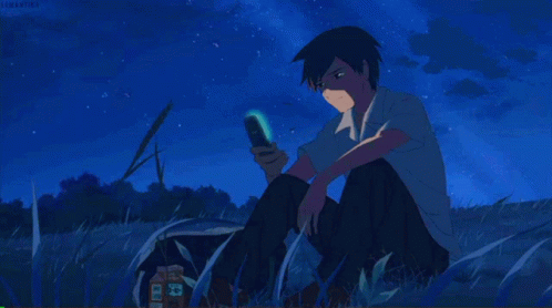 A Cartoon Of A Boy Sitting In The Grass Looking At His Cell Phone GIF