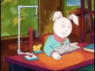A Cartoon Of A Bunny Reading A Book With A Sad Face GIF