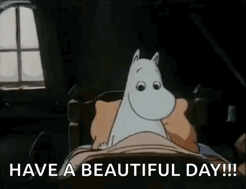 A Cartoon Of A Cat Laying In A Bed With The Words `` Have A Beautiful Day ! '' GIF