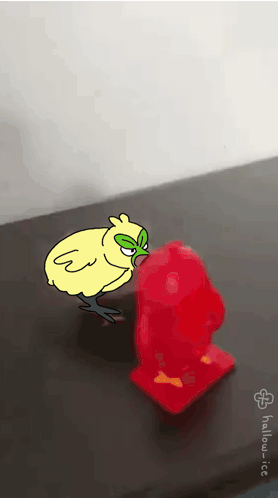 Chicken With Green Mask Next To Red Object GIF