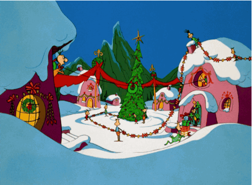 A Cartoon Of A Christmas Village With A Christmas Tree GIF