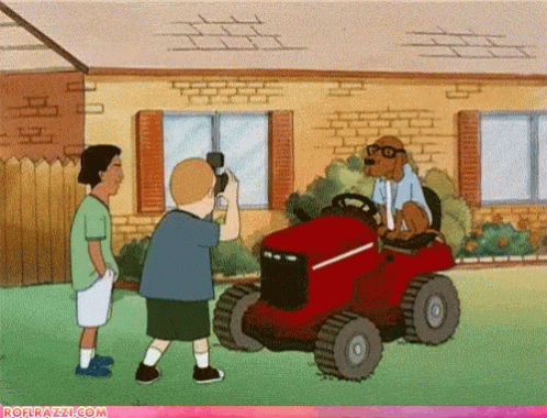 A Cartoon Of A Dog Riding A Lawn Mower With The Website Rofrazzi.com At The Bottom GIF