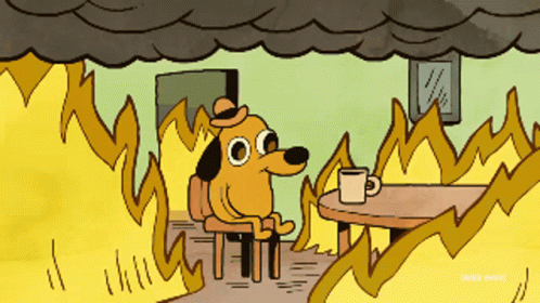 A Cartoon Of A Dog Sitting At A Table With A Cup Of Coffee Surrounded By Fire GIF
